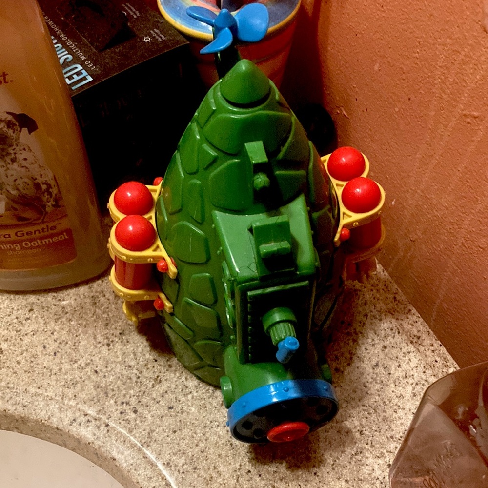 I’m selling a boat green yellow orange blue toy